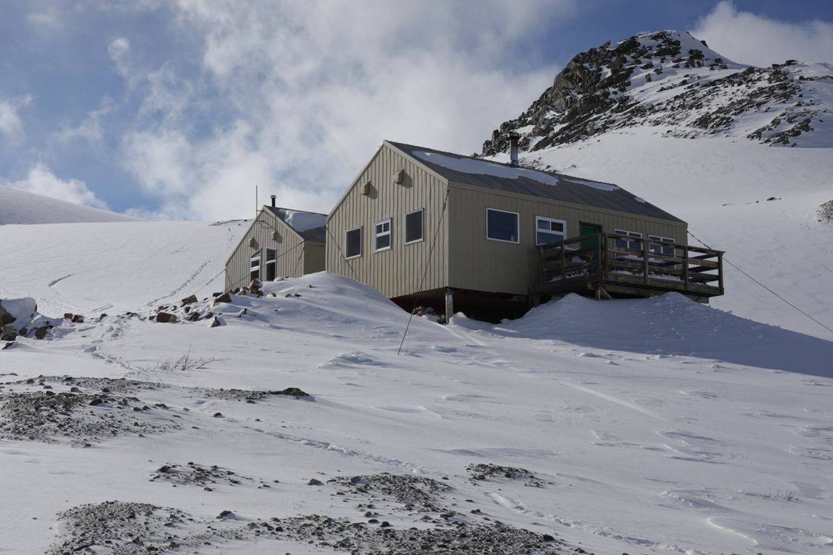 Alpine hut in fresh snow