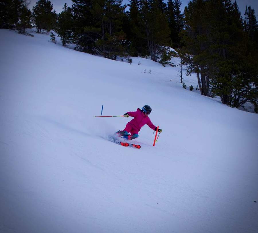 Young skier carving a turn on a groomed run