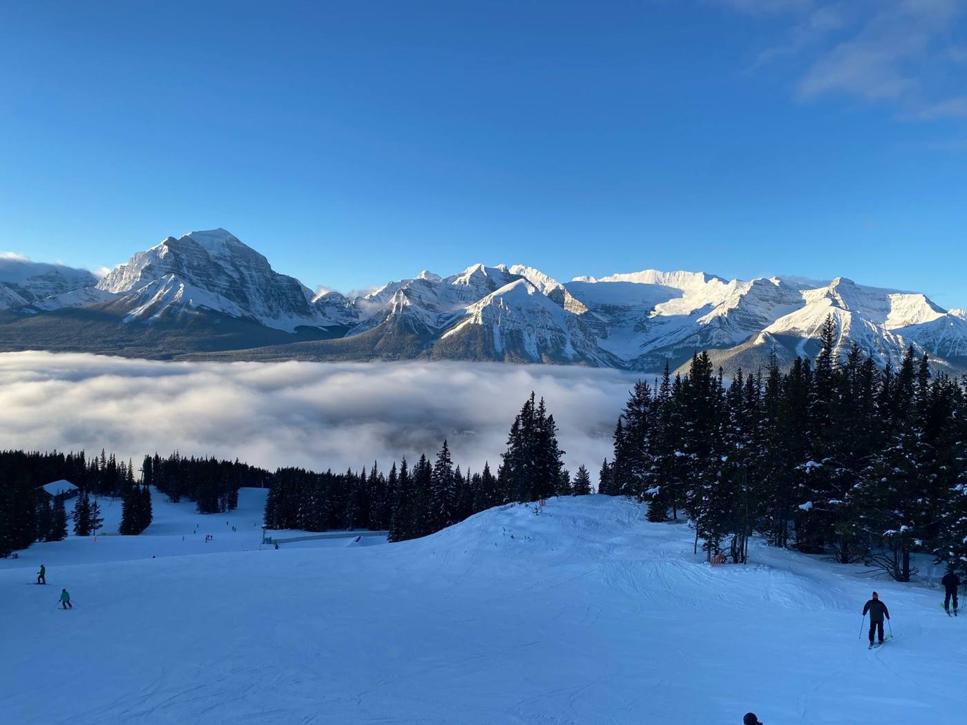 Snowy peaks above a cloud-filled valley at Lake Louise