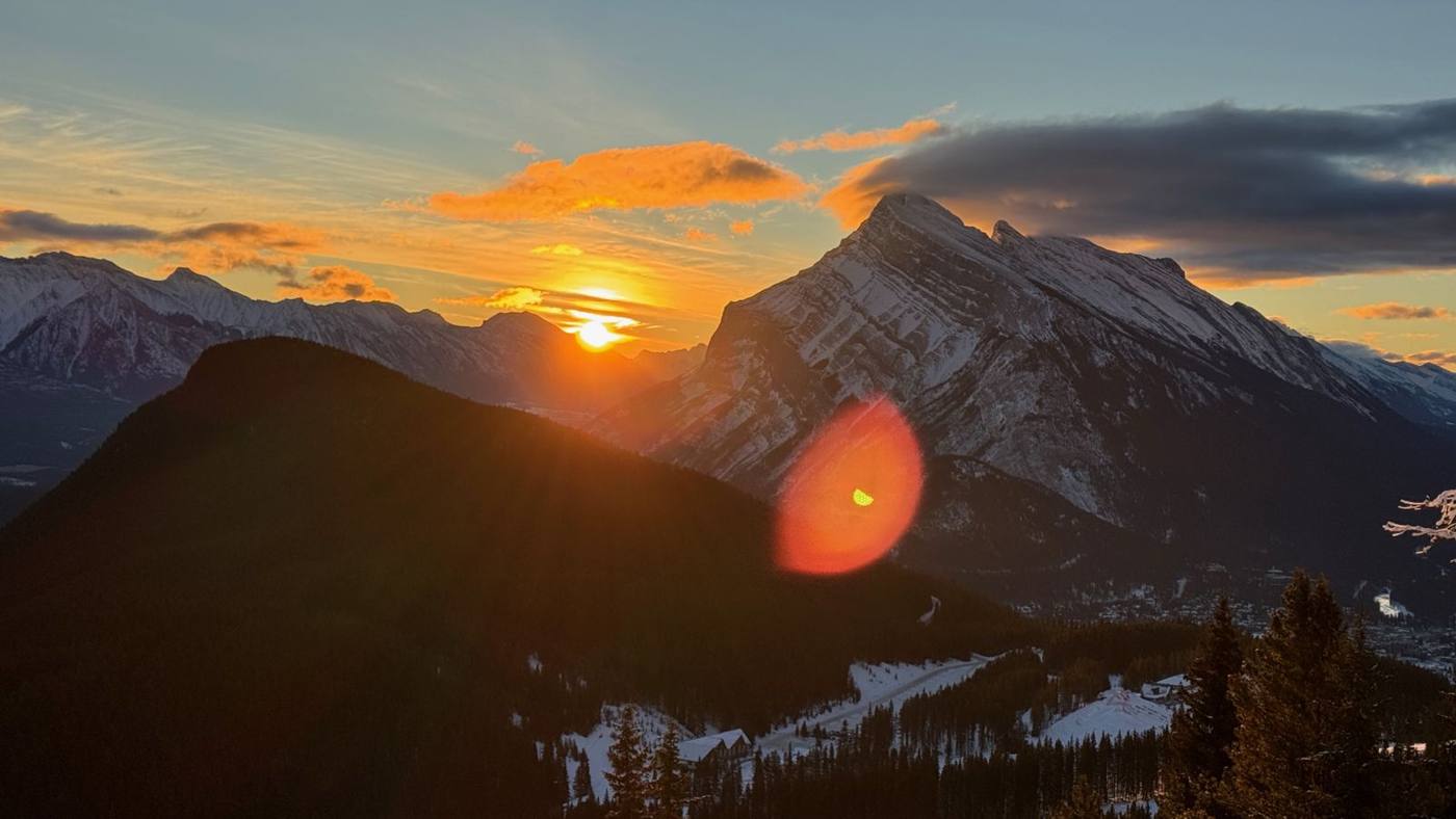 Sunset behind a mountain peak