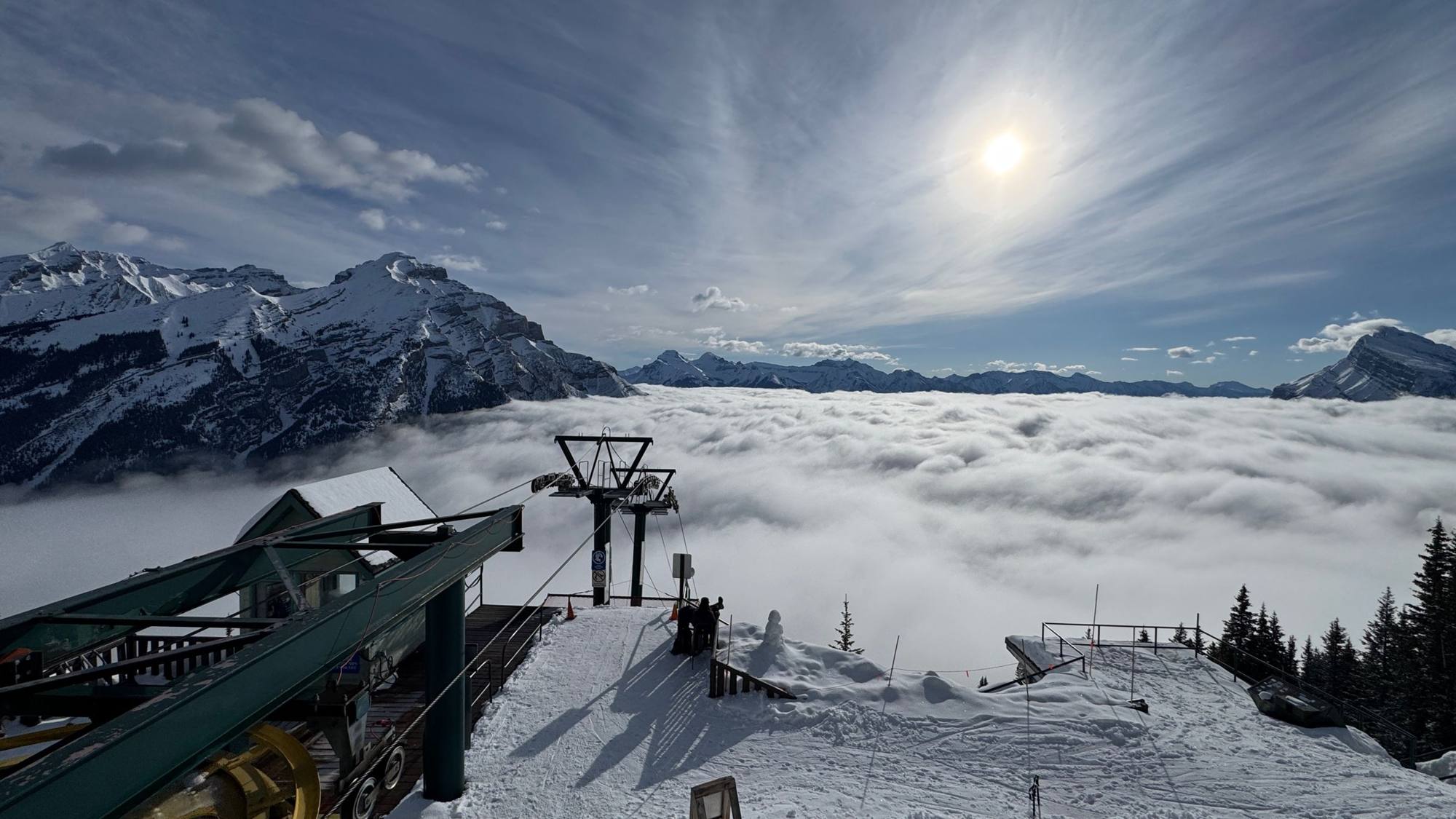 Chairlift summit above a sea of cloud in the Bow Valley